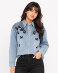 Close-up front view of butterfly embroidered denim shirt