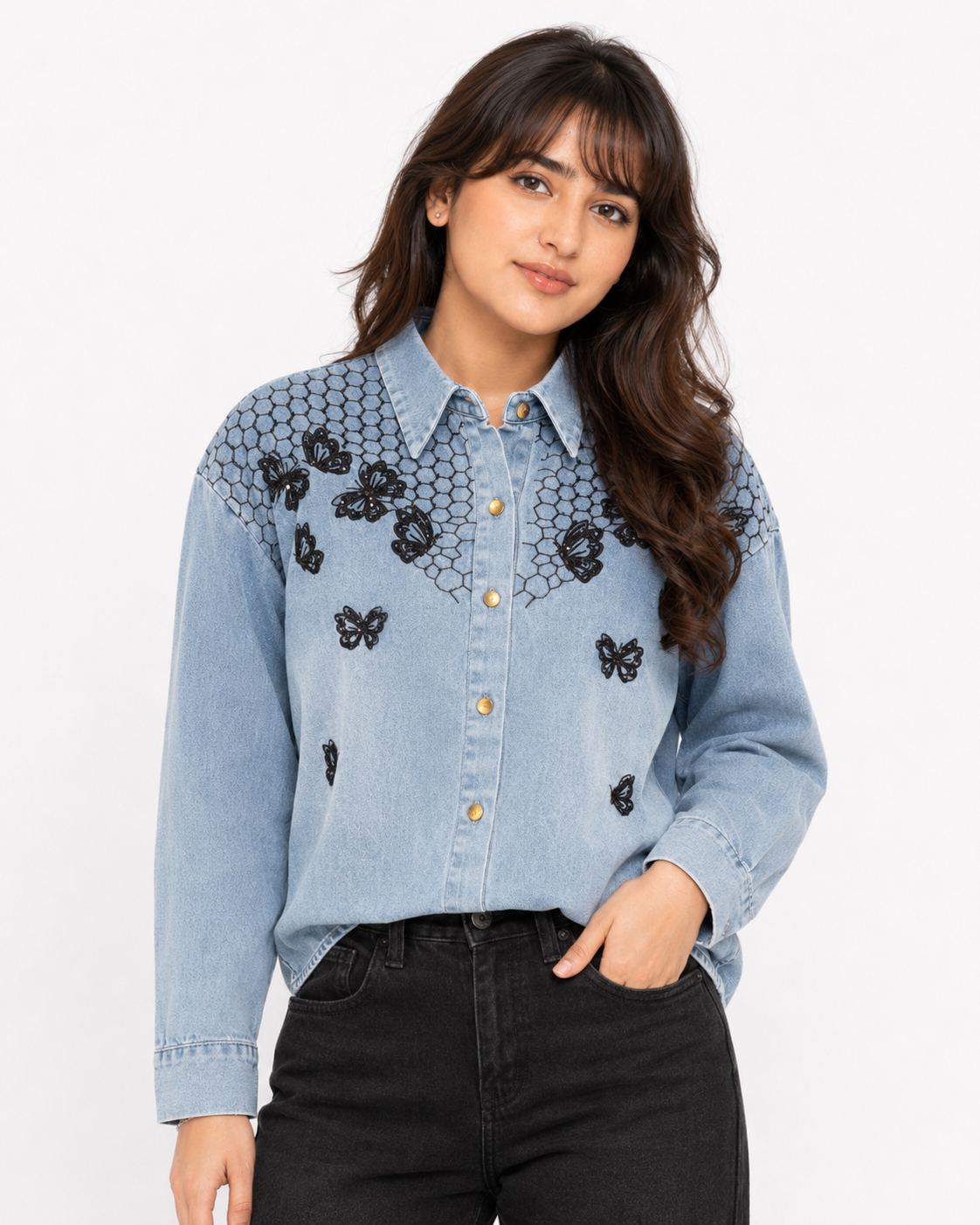 Close-up front view of butterfly embroidered denim shirt