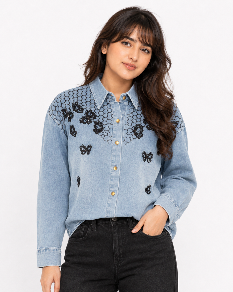 Close-up front view of butterfly embroidered denim shirt